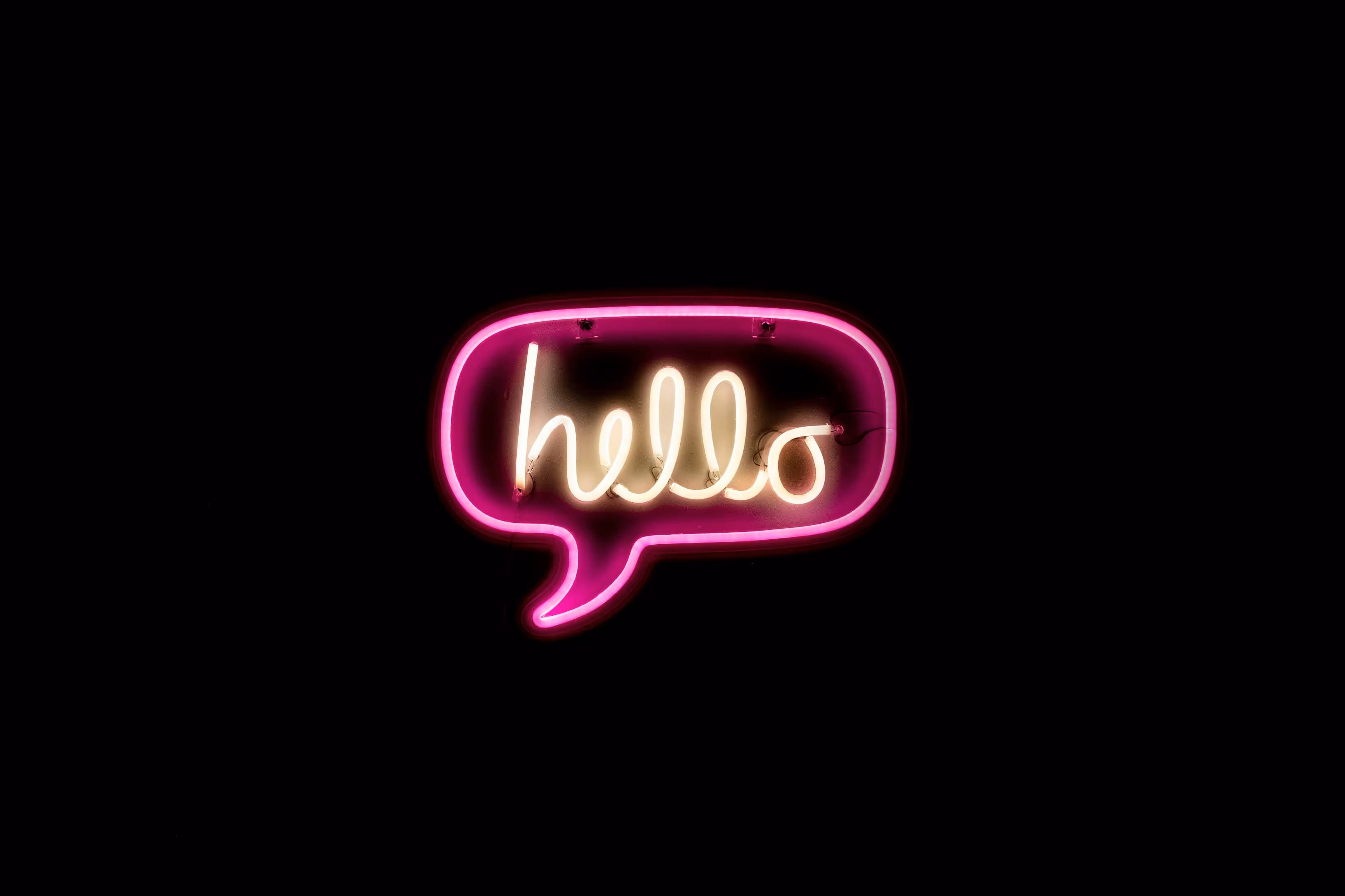Neon sign of 'hello' inside a speech bubble